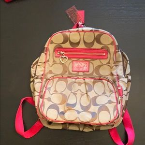 Brown/pink signature pink Coach backpack bag